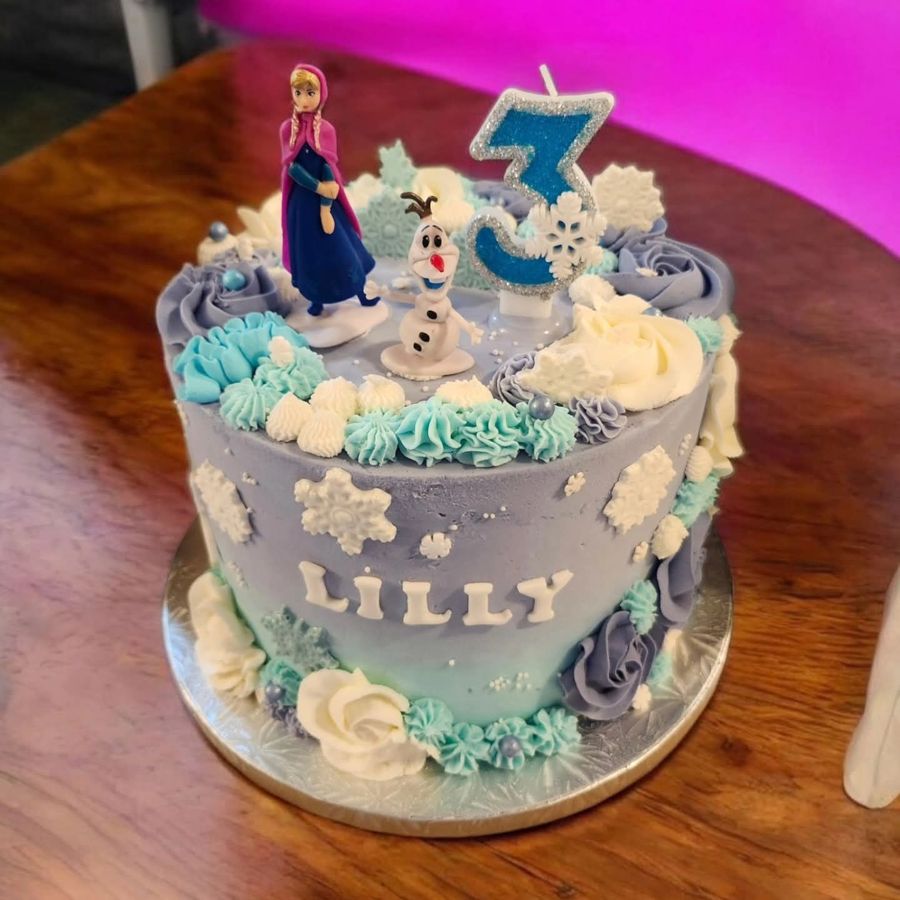 Lavender and blue Frozen cake with Anna, Olaf and snowflakes for a 3rd birthday