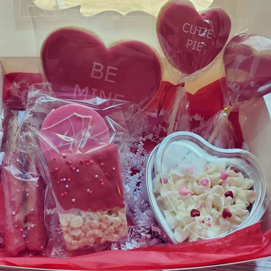 Valentine treat box with Be Mine heart cookies, dipped Rice Krispie treat and frosting cup